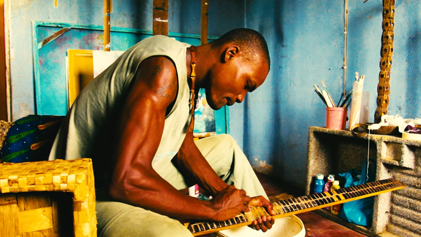 São Toméan artist working in a blue room
